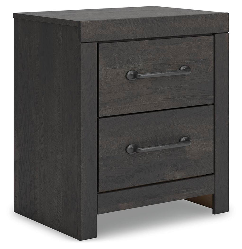 Ashley Furniture Hollivern bedroom set with a stylish bed frame, nightstands, and matching decor arranged in a modern bedroom scene.