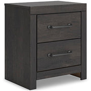 Ashley Furniture Hollivern bedroom set, angled view showing bed frame, headboard, and accompanying furniture pieces.