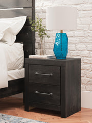 Ashley Furniture Hollivern Bedroom Set featuring a modern bed frame, matching nightstands, and coordinated bedroom furniture.