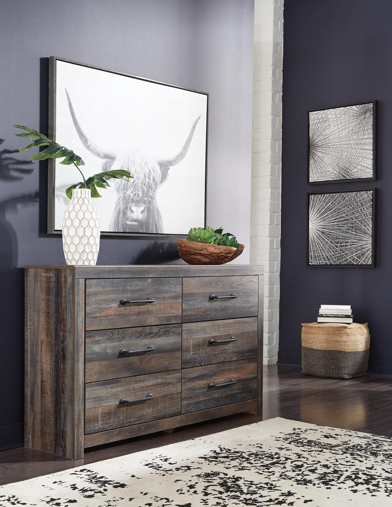 Ashley Furniture Drystan Dresser with six drawers, dark wood finish, and sleek modern design for bedroom storage.