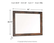 Ashley Furniture Drystan bedroom mirror with a large rectangular frame, showcasing a modern design with a sleek wood finish.