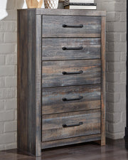Ashley Furniture Drystan chest of drawers, modern wooden bedroom storage with multiple drawers, in a natural finish.