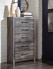 Ashley Furniture Drystan chest of drawers with a dark wood finish and multiple storage drawers.