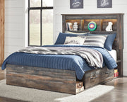 Ashley Furniture Drystan Youth Bed with two storage drawers, featuring a sturdy frame and wooden finish for kids' bedroom.