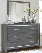 Ashley Furniture Lodanna bedroom set with a wooden bed frame, nightstands, and dresser in a stylish bedroom interior.