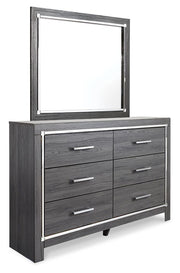 Ashley Furniture Lodanna bedroom set with a stylish bed, nightstands, and dresser, shown from an angled view in a cozy bedroom setting.