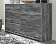 Ashley Furniture Baystorm dresser with sleek wood finish and multiple drawers, shown from a front view.