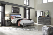 Ashley Furniture Baystorm youth bedroom set featuring a bed, dresser, and nightstand in a modern, stylish bedroom scene.