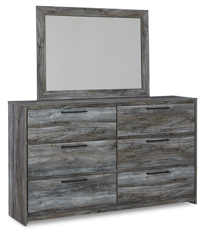 Ashley Furniture Baystorm dresser with matching mirror, showcasing a modern wooden bedroom furniture set in a well-lit room.