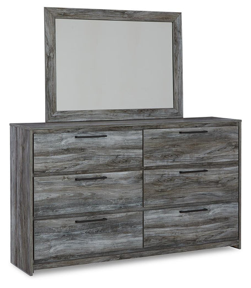 Ashley Furniture Baystorm dresser with matching mirror, showcasing a modern wooden bedroom furniture set in a well-lit room.