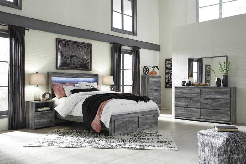 Ashley Furniture Baystorm nightstand with wood finish, featuring a sleek tabletop and storage drawer, modern bedroom decor.