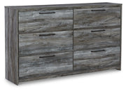 Ashley Furniture Baystorm dresser and mirror set, angled view showing the wooden dresser with mirror attached and detailed hardware.