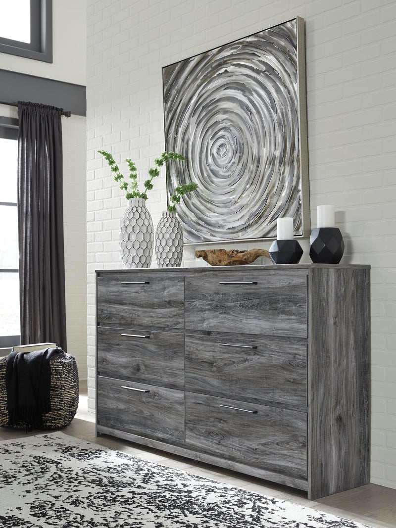 Ashley Furniture Baystorm Dresser with six drawers and sleek wood finish, featuring modern hardware and clean design.