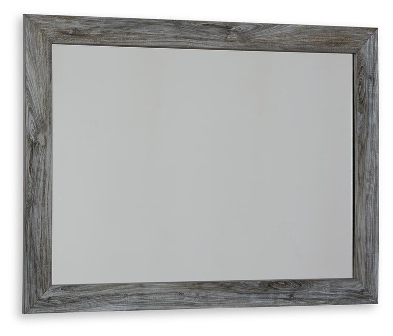 Ashley Furniture Baystorm dresser and mirror set, showing a modern wood dresser with a matching mirror in a well-lit room.