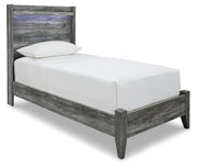 Ashley Furniture Baystorm Youth Bed with angled design and wood finish, ideal for a child's bedroom.