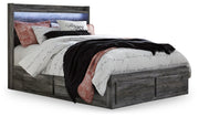 Ashley Furniture Baystorm storage bed with wood finish and built-in drawers, showcasing a stylish and functional bedroom centerpiece.