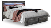 Ashley Furniture Baystorm Storage Bed with built-in drawers, featuring a modern design and neutral finish, shown in a well-lit bedroom setting.