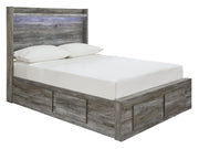 Ashley Furniture Baystorm Storage Bed showing a modern bed frame with built-in storage drawers and a sleek wood finish.
