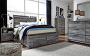 Ashley Furniture Baystorm Storage Bed with built-in drawers, featuring a modern wood finish and sleek design for bedroom storage.