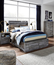 Ashley Furniture Baystorm Storage Bed with built-in drawers and sturdy wood frame, shown in a stylish bedroom setting.