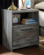 Ashley Furniture Baystorm nightstand with a sleek wood finish and modern design, featuring a single drawer and open shelf.