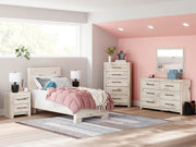 Ashley Furniture Lawroy Bed featuring a modern design with a wood frame and neutral finish, shown in a stylish bedroom setting.