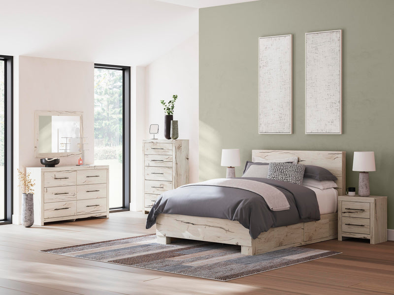 Ashley Furniture Lawroy Bed with upholstered headboard and dark wood frame, shown in a stylish bedroom setting.