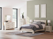 Ashley Furniture Lawroy Bed with a modern wooden frame and neutral finish, showcasing its stylish headboard design.