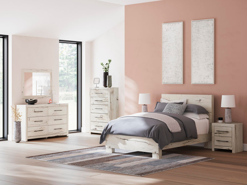 Ashley Furniture Lawroy Bed with a sturdy wooden frame and classic design, shown in a well-lit bedroom setting.