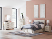 Ashley Furniture Lawroy Panel Storage Bed showing a modern wooden bed frame with built-in storage drawers.