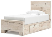 Ashley Furniture Lawroy Bed with a stylish upholstered headboard and modern design, shown from an angled side view.
