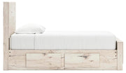 Ashley Furniture Lawroy Bed with sleek design, shown in a modern bedroom setting with neutral-toned bedding and stylish headboard