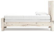 Ashley Furniture Lawroy Bed in a modern bedroom setting with a wooden frame and upholstered headboard.