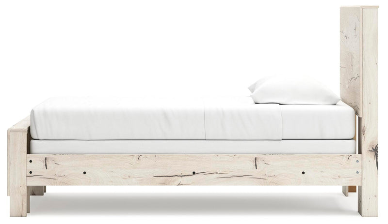 Ashley Furniture Lawroy Bed in a modern bedroom setting with a wooden frame and upholstered headboard.