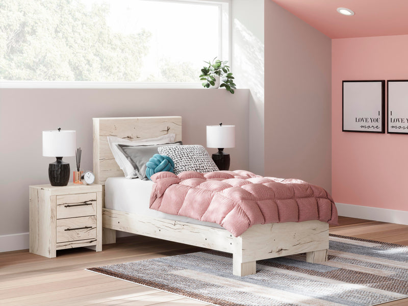 Ashley Furniture Lawroy Bed with a classic wooden frame and headboard, shown in a warm, elegant bedroom setting.
