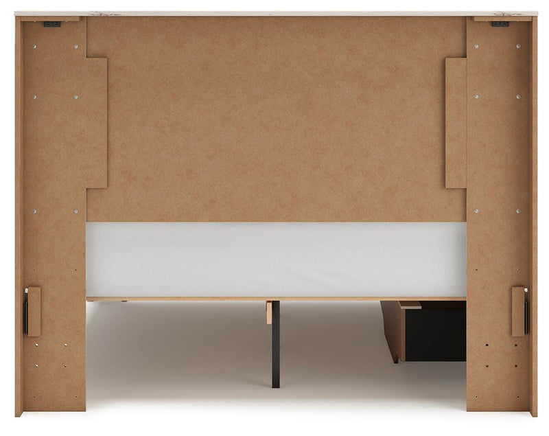 Ashley Furniture Lawroy Bed with upholstered headboard and wooden frame, shown in a stylish bedroom setting.
