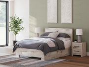 Ashley Furniture Lawroy bed with a modern wooden frame and neutral upholstery, showcased in a stylish bedroom setting.