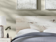 Ashley Furniture Lawroy Bed with upholstered headboard and sleek wooden frame, shown in a stylish bedroom setting.