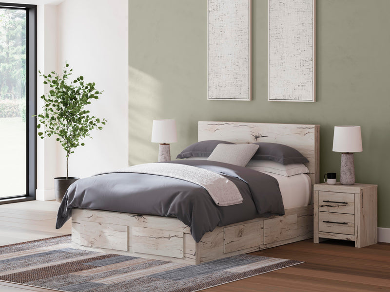 Ashley Furniture Lawroy Panel Storage Bed with sleek wood finish and built-in storage drawers, showcasing a modern bedroom centerpiece.