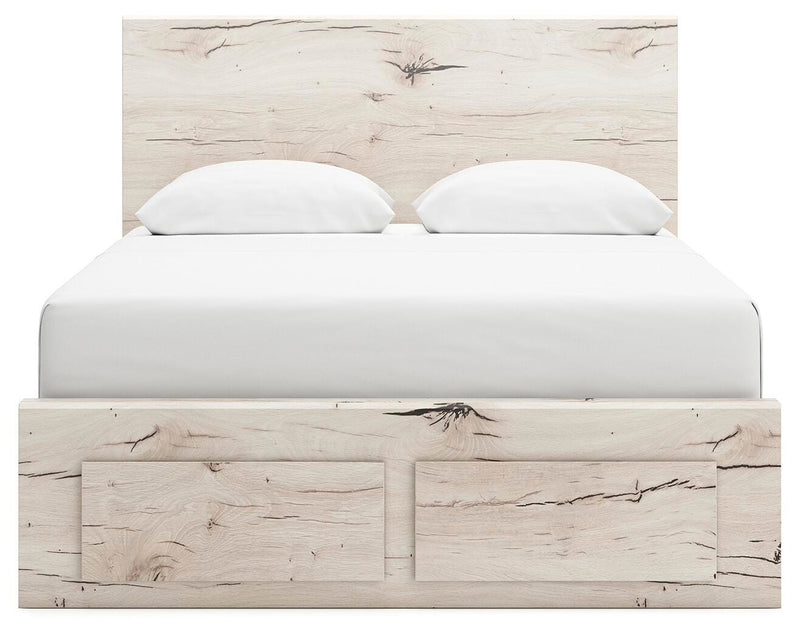 Ashley Furniture Lawroy Panel Storage Bed with headboard and storage drawers, shown from a front view in a modern bedroom setting.