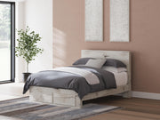 Ashley Furniture Lawroy panel storage bed with built-in drawers and modern design, shown in a cozy bedroom setting.