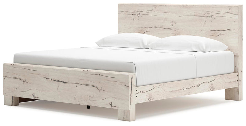 Angle view of Ashley Furniture Lawroy Bed with upholstered headboard and wooden frame in a modern bedroom setting.