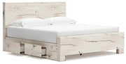 Ashley Furniture Lawroy Bed with a stylish wooden frame and open-slat design, shown from an angled side view.