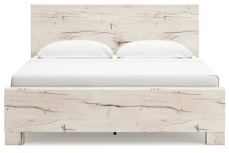 Ashley Furniture Lawroy Bed with upholstered headboard featuring fabric and nailhead trim, shown in a head-on view.