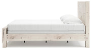 Ashley Furniture Lawroy Bed with beige upholstered headboard and wooden frame, shown from a side angle.