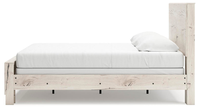 Ashley Furniture Lawroy Bed with beige upholstered headboard and wooden frame, shown from a side angle.