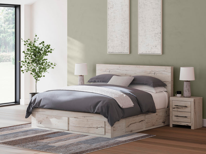 Ashley Furniture Lawroy Panel Storage Bed with wood finish and built-in storage drawers in a modern bedroom setting.