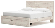 Ashley Furniture Lawroy panel storage bed with a modern design, shown from an angled side view highlighting the headboard and storage drawers.