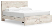 Ashley Furniture Lawroy panel storage bed with a sleek wooden frame and built-in storage drawers, shown from an angled side view.