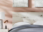 Ashley Furniture Lawroy Bed with a detailed view of the headboard, showcasing elegant wood finish and classic design.